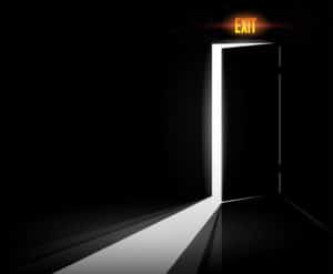 Dark room with exit sign