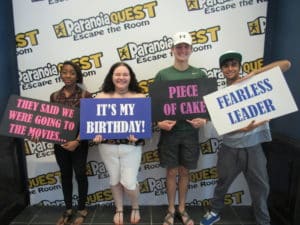 Group of participants with signs all around