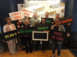 Group of participants with signs all around