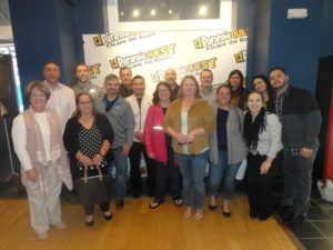 Group of participants with signs all around