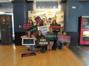 Group of participants with signs all around