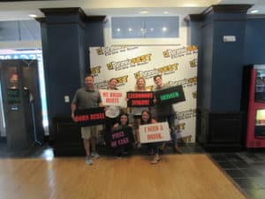 Group of participants with signs all around