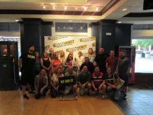 Group of participants with signs all around