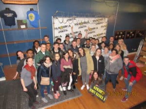 Group of participants with signs all around